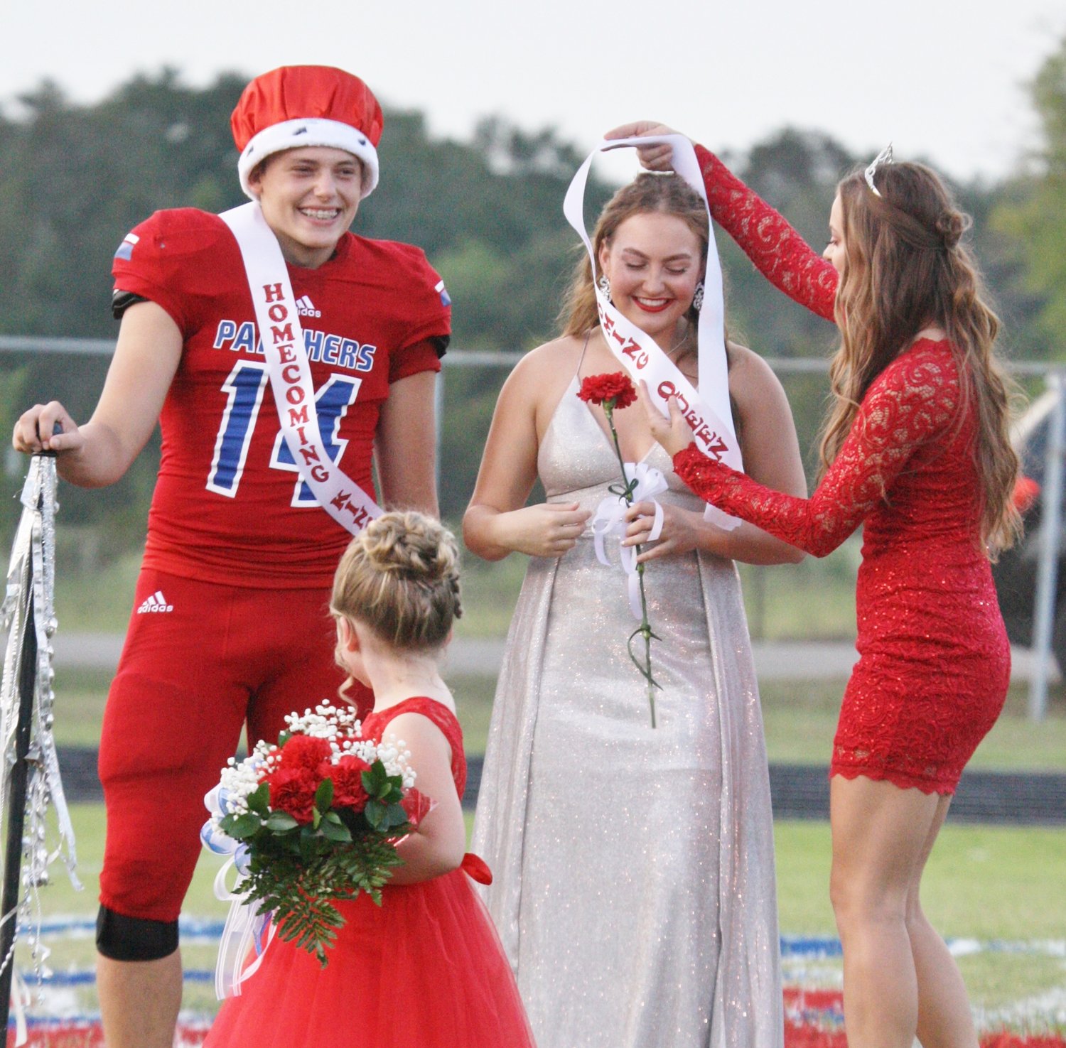 Ann Marie Pendergrass is crowned Alba-Golden High School Homecoming Queen, as Homecoming King Jon-Michael Chadwick looks on Friday night.